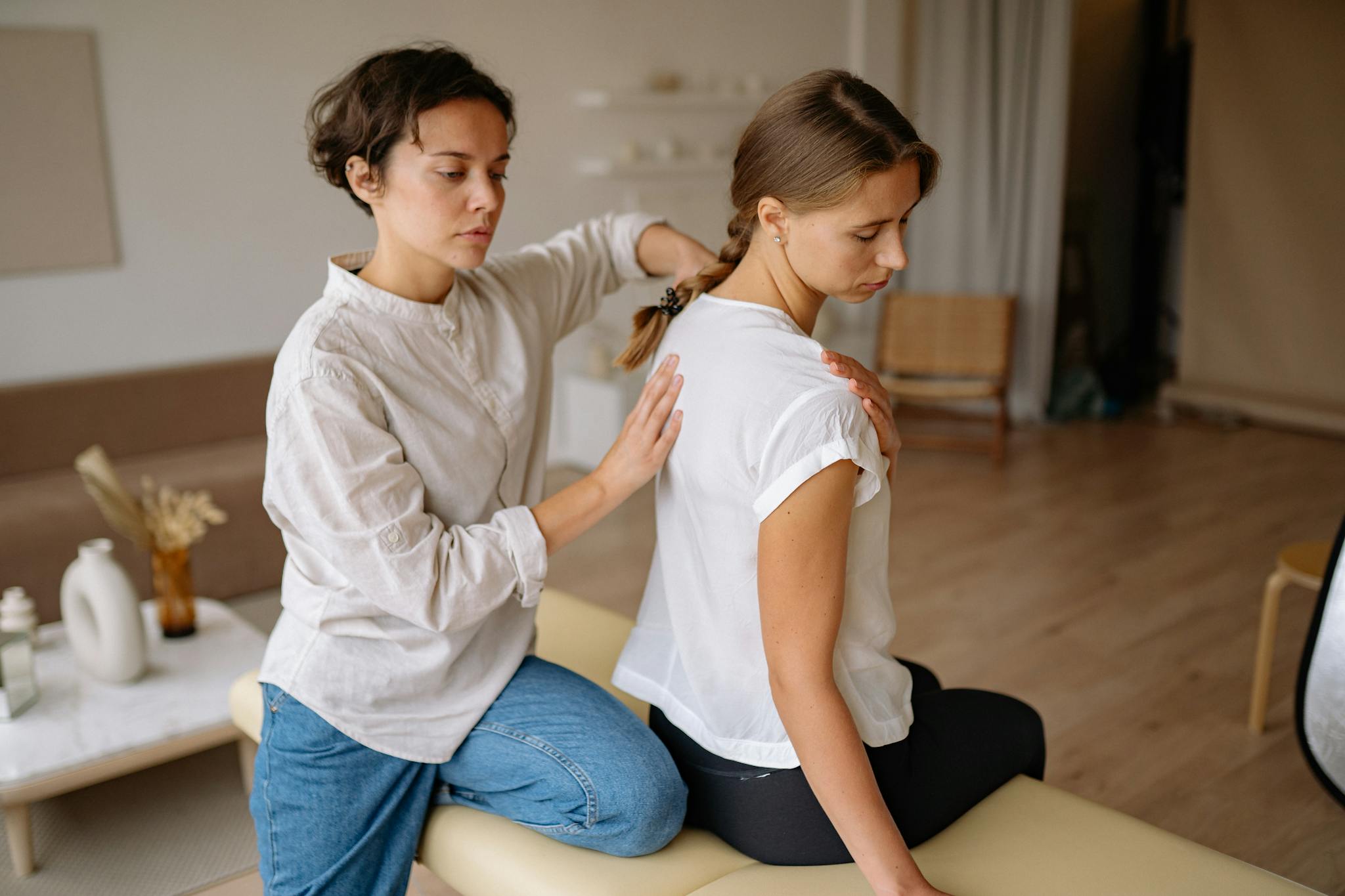 A Client Having a Massage Sitting on a Massage Table